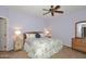 Spacious bedroom with king-size bed and light-purple walls at 15050 N Thompson Peak Pkwy # 1010, Scottsdale, AZ 85260