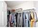 Walk-in closet with double hanging rods and shelving at 15050 N Thompson Peak Pkwy # 1010, Scottsdale, AZ 85260