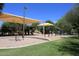 Modern playground with slides and shade structures at 15050 N Thompson Peak Pkwy # 1010, Scottsdale, AZ 85260