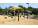 Playground with swings and shade structures at 15050 N Thompson Peak Pkwy # 1010, Scottsdale, AZ 85260