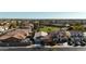 Aerial view of a house and neighborhood with a park nearby at 15081 N 176Th Ln, Surprise, AZ 85388