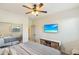 Main bedroom with large bed, TV, and mirrored closet doors at 15081 N 176Th Ln, Surprise, AZ 85388