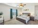 Main bedroom with large bed, nightstands, and green curtains at 15081 N 176Th Ln, Surprise, AZ 85388