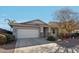 One-story house with a two-car garage and well-maintained landscaping at 15081 N 176Th Ln, Surprise, AZ 85388