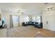 Bright living room featuring a sectional sofa and lots of natural light at 15081 N 176Th Ln, Surprise, AZ 85388