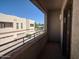 Private balcony with view of neighboring building and a security net at 15818 N 25Th St # 116, Phoenix, AZ 85032