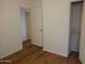 Bright bedroom with wood flooring and closet at 15818 N 25Th St # 116, Phoenix, AZ 85032