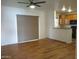 Living room with wood-look floors and ceiling fan at 15818 N 25Th St # 116, Phoenix, AZ 85032