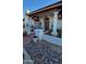 Front entry with columns, tile flooring, and a wooden door at 15829 N 12Th St, Phoenix, AZ 85022