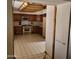 View into kitchen with wood cabinets and tile floors at 15829 N 12Th St, Phoenix, AZ 85022