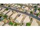 Aerial view of a residential neighborhood with houses and solar panels at 15913 W Elm St, Surprise, AZ 85374