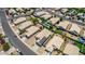 Aerial view of a house with solar panels and a neighborhood at 15913 W Elm St, Surprise, AZ 85374