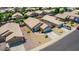 Aerial view of house with solar panels and neighborhood at 15913 W Elm St, Surprise, AZ 85374