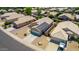 Aerial view of a house with solar panels and a driveway at 15913 W Elm St, Surprise, AZ 85374