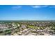 Aerial view of a community with houses, roads and distant mountains at 15913 W Elm St, Surprise, AZ 85374