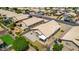 Aerial view of house with solar panels, backyard and pool at 15913 W Elm St, Surprise, AZ 85374