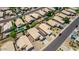 Aerial view showcasing a neighborhood with pools and solar panels at 15913 W Elm St, Surprise, AZ 85374