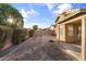 Spacious backyard with covered patio and gravel at 15913 W Elm St, Surprise, AZ 85374