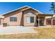 Backyard view of house with covered patio and gravel at 15913 W Elm St, Surprise, AZ 85374