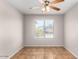 Bright bedroom with tile flooring and a ceiling fan at 15913 W Elm St, Surprise, AZ 85374