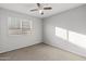 Bright bedroom with ceiling fan and neutral wall colors at 15913 W Elm St, Surprise, AZ 85374