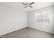 Spacious bedroom featuring a ceiling fan and window blinds at 15913 W Elm St, Surprise, AZ 85374