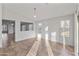 Sunlit dining area with tile floors and multiple windows at 15913 W Elm St, Surprise, AZ 85374