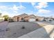 House exterior with gravel landscaping and driveway at 15913 W Elm St, Surprise, AZ 85374