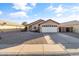 Single story home with attached garage and desert landscaping at 15913 W Elm St, Surprise, AZ 85374