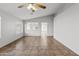 Spacious living room featuring tile floors and a ceiling fan at 15913 W Elm St, Surprise, AZ 85374