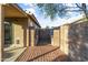 Brick patio with built-in BBQ area and block wall at 15913 W Elm St, Surprise, AZ 85374