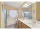 Double vanity bathroom with a soaking tub and separate shower at 1616 N 125Th Ln, Avondale, AZ 85392