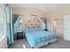 Bright bedroom with ensuite bathroom access and a view of the backyard pool at 1616 N 125Th Ln, Avondale, AZ 85392