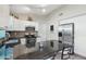 Modern kitchen with stainless steel appliances and granite island at 1616 N 125Th Ln, Avondale, AZ 85392