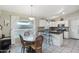 Modern kitchen with white cabinets and granite countertops at 1616 N 125Th Ln, Avondale, AZ 85392