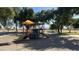 playground with swings and climbing structures at 1616 N 125Th Ln, Avondale, AZ 85392