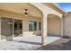 Covered patio with sliding glass doors and ceiling fan at 16955 W Holly St, Goodyear, AZ 85395