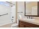 Bathroom with single vanity, tub, and shower at 16955 W Holly St, Goodyear, AZ 85395