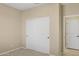 Bedroom with double door closet and access to bathroom at 16955 W Holly St, Goodyear, AZ 85395