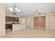 Open dining area with chandelier and tile floors at 16955 W Holly St, Goodyear, AZ 85395