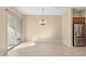 Bright dining room with tile floors and sliding glass door at 16955 W Holly St, Goodyear, AZ 85395