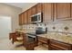 Modern kitchen with ample cabinetry and granite countertops at 16955 W Holly St, Goodyear, AZ 85395