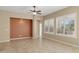 Living room with tile floors and large windows at 16955 W Holly St, Goodyear, AZ 85395