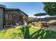 Backyard with patio and seating area, next to a modern house at 1837 E Minnezona Ave, Phoenix, AZ 85016