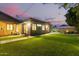 Night view of backyard showcasing new addition and landscaping at 1837 E Minnezona Ave, Phoenix, AZ 85016