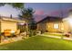 Backyard view at night showing patio, fire pit and landscaping at 1837 E Minnezona Ave, Phoenix, AZ 85016