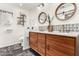 Modern bathroom with double vanity, stylish tilework, and a large mirror at 1837 E Minnezona Ave, Phoenix, AZ 85016