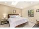 Bright bedroom with a skylight, mid-century modern furniture, and neutral decor at 1837 E Minnezona Ave, Phoenix, AZ 85016