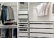 Walk-in closet with ample shelving and drawers for storage at 1837 E Minnezona Ave, Phoenix, AZ 85016