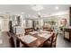 Dining area with a wooden table, chairs, and a modern chandelier at 1837 E Minnezona Ave, Phoenix, AZ 85016